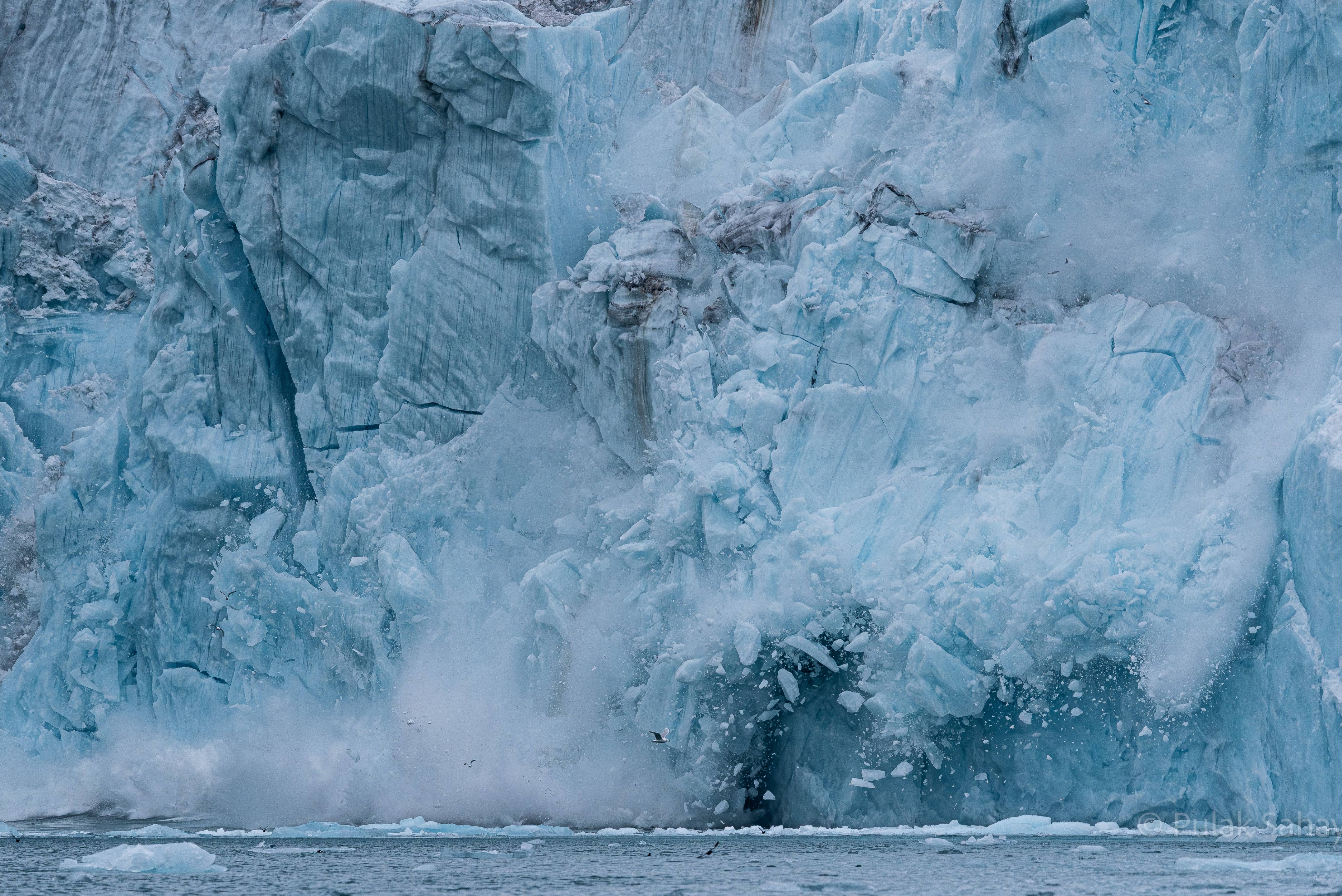Iceberg face crashing down